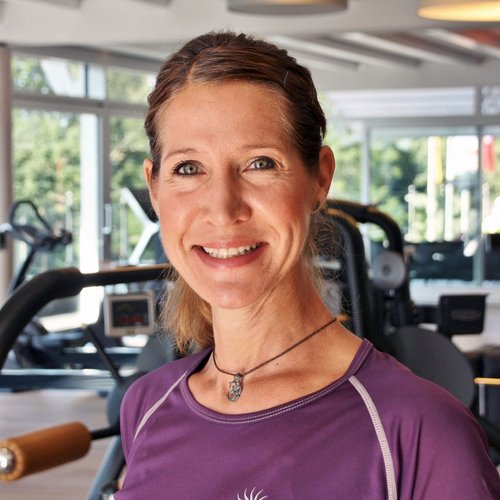 Our mission: your dream holiday in Oberstaufen Woman in sportswear smiling in a gym